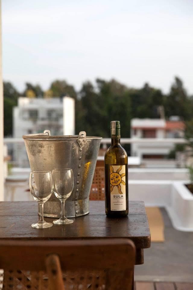 Outdoor seating and greenery on the Love OORU rooftop.