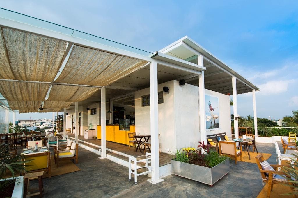Guests enjoying the open-air rooftop lounge at Love OORU Market.
